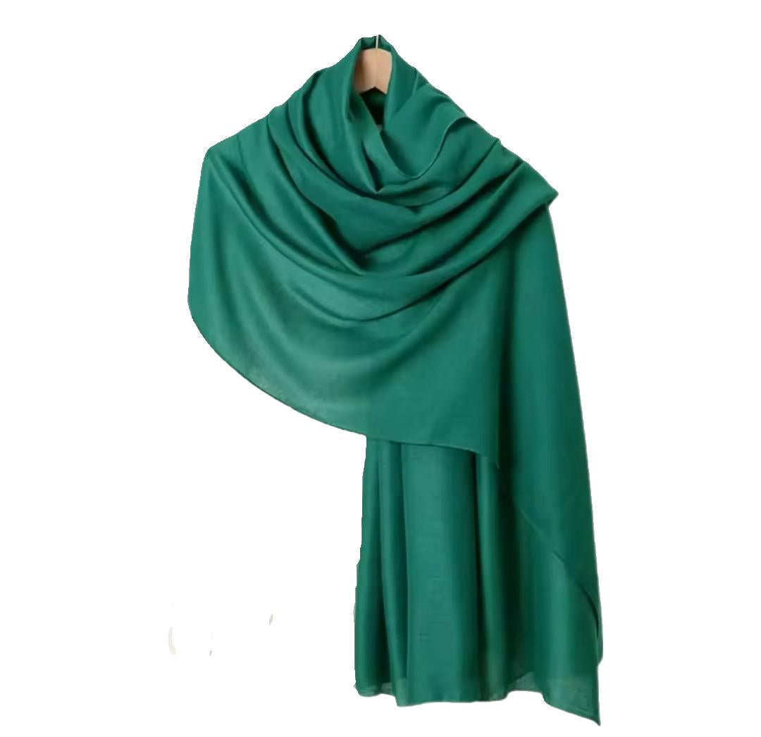 www.amodeyah.com/cdn/shop/file/Green Cotton-Linen Hijab | Textured & Breathable.jpg